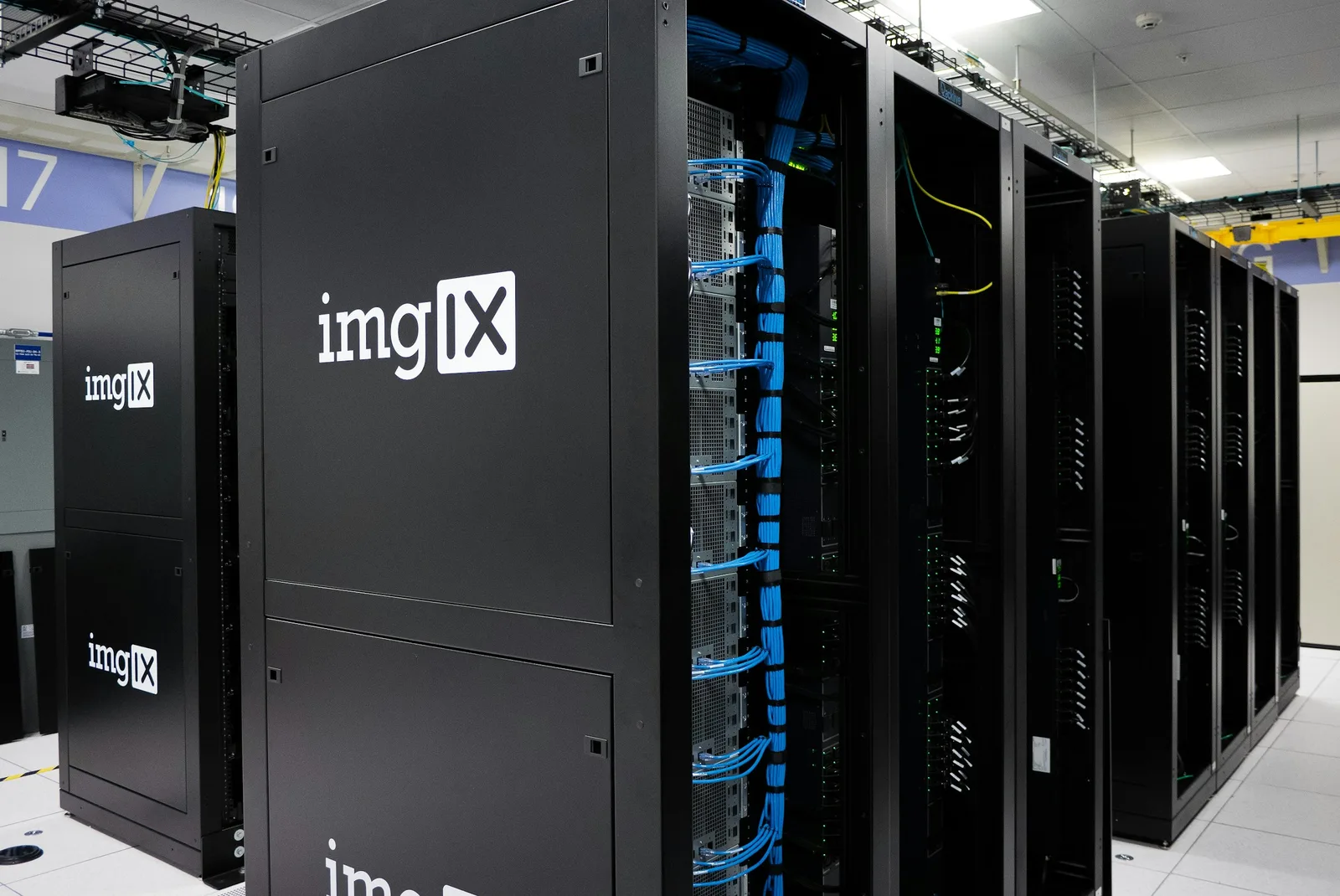 Server racks and managed cabling representing supervised network infrastructure