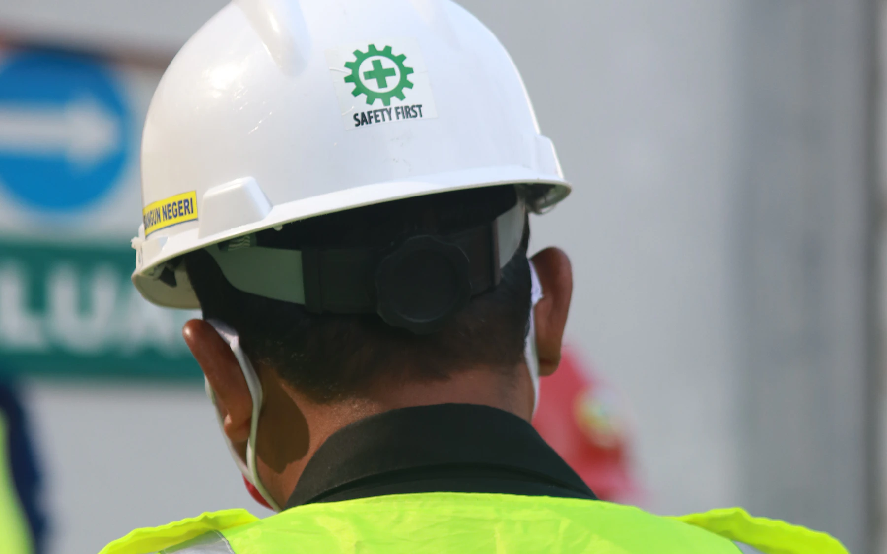 Site worker wearing high-visibility protective equipment