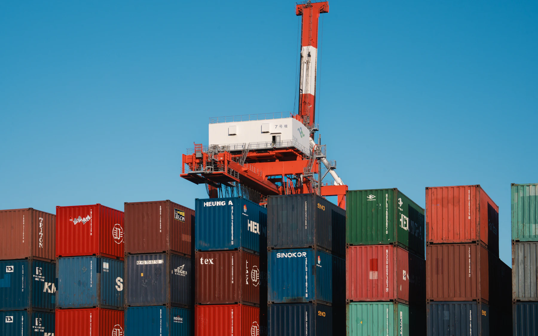 Container terminal showing stacked cargo and crane operations